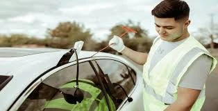 Guardian Locksmith technician opening car door DFW TX