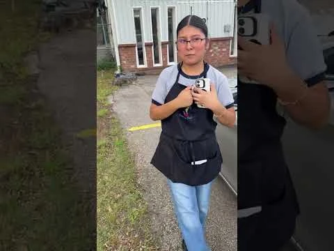 A woman reviewing Guardian Locksmith after a car lockout